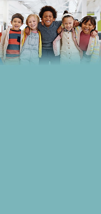 Pediatric dermatologists: Group of happy children smiling together indoors Pediatric Dermatologists in the Philadelphia area Banner